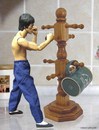 Cartoon: bruce lee (small) by tanerbey tagged bruce,lee,trainning,dummy,cup,holder